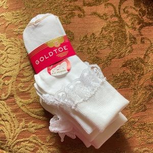New with tags three pack of GoldToe turn cuff girls socks. Size medium.